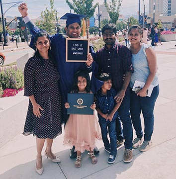 male graduate with 5 family members at SLC commencement 2019