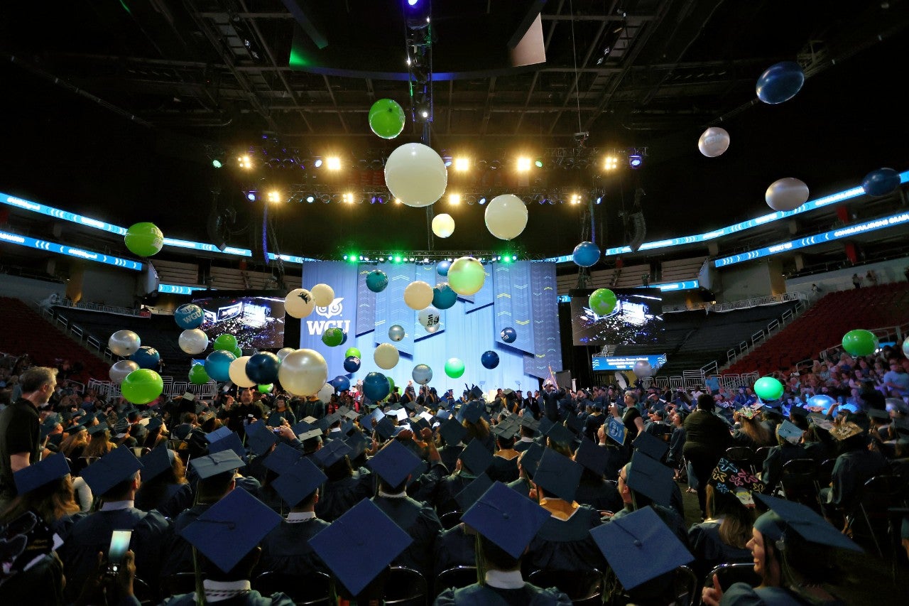 man in blue shirt presenting in meeting