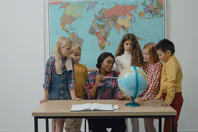 Teacher surrounded by students