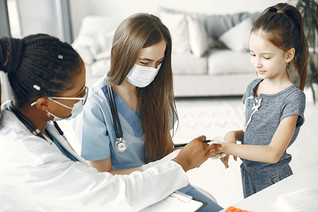 Four nurses looking at camera