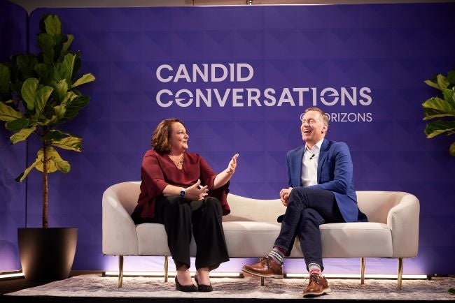 WGU President Scott Pulsipher and Jobs for the Future President Maria Flynn sit on stage at JFF Horizons. They are on a white couch with a purple background engaged in conversation.