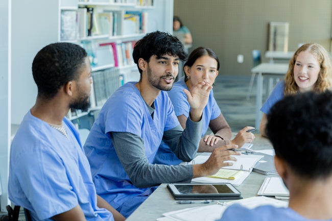 Four nurses looking at camera