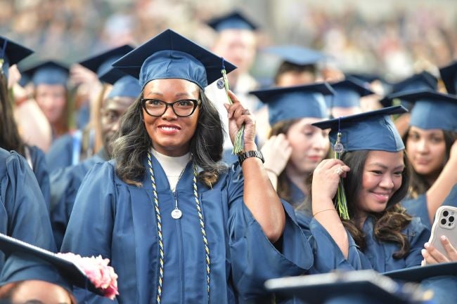 Graduate completing their degree