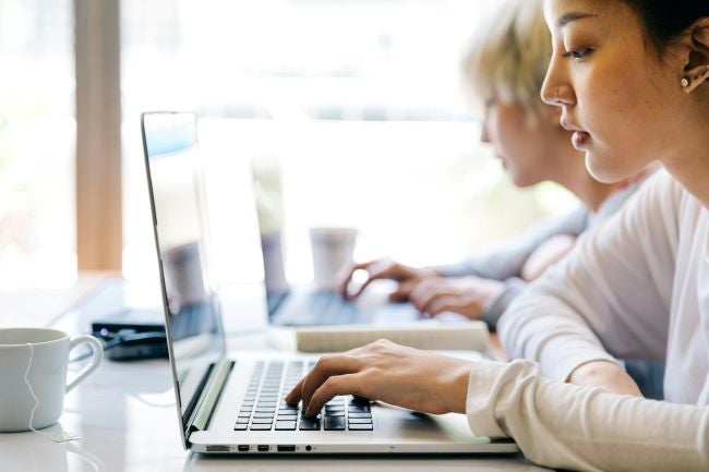 A woman working on her computer