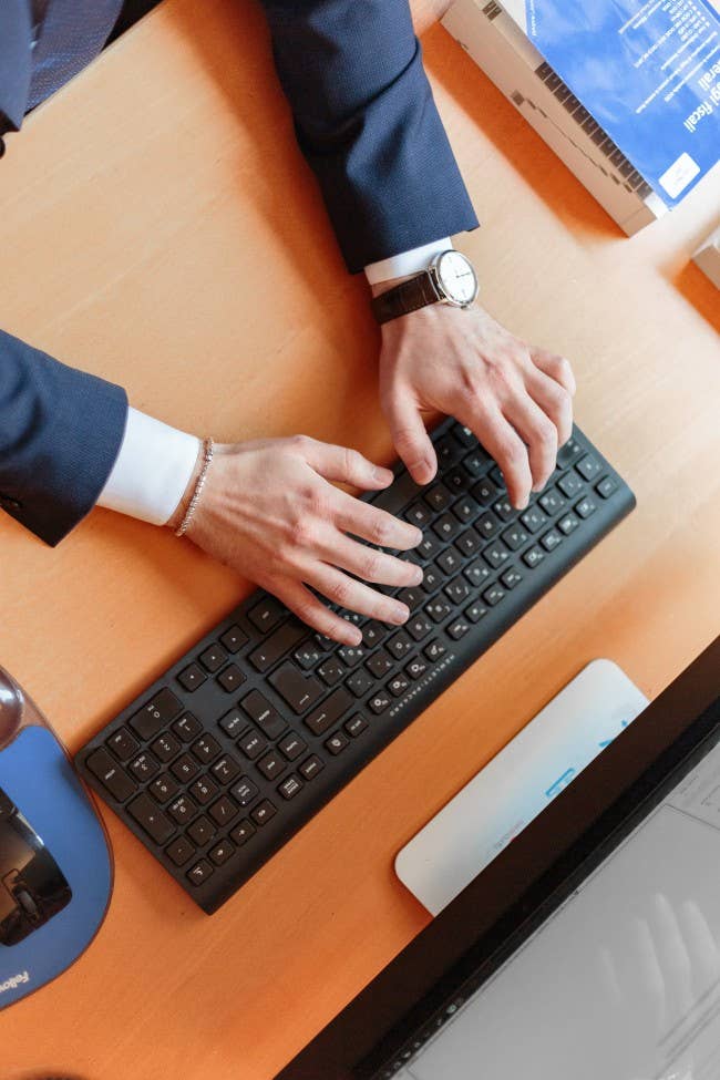 Man's hands on keyboard