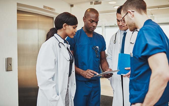 group of healthcare professionals reviewing information