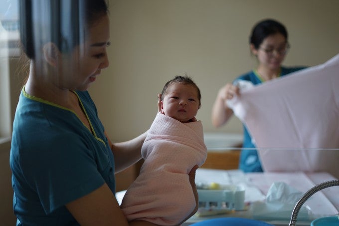 Nurse holding a new baby