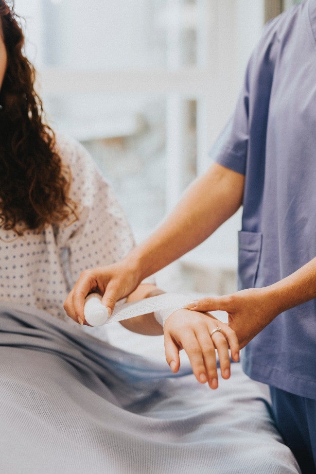 Wrapping bandage on woman