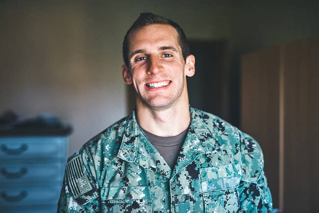 Navy man smiling at the camera