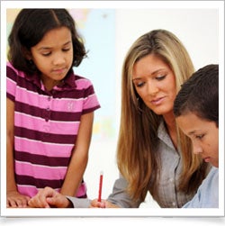Teacher helping students