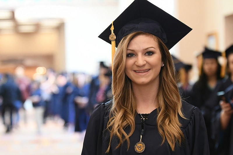 WGU graduate at commencement portrait
