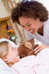 Nurse attending to young patient