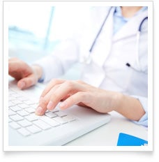 Doctor typing on a computer keyboard