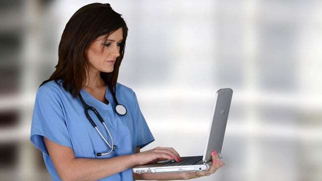 Nurse on old laptop