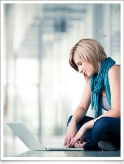 WGU online student at laptop