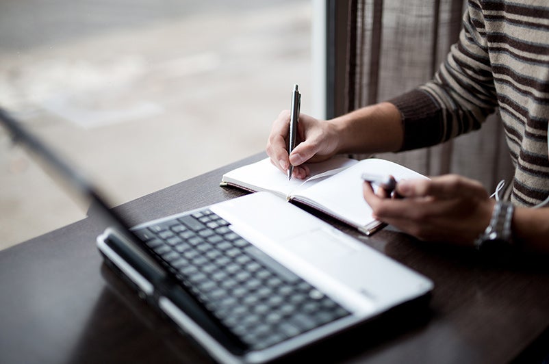 Person taking analog notes