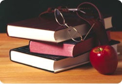 Pile of books with an apple