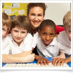 Teacher with students on keyboard