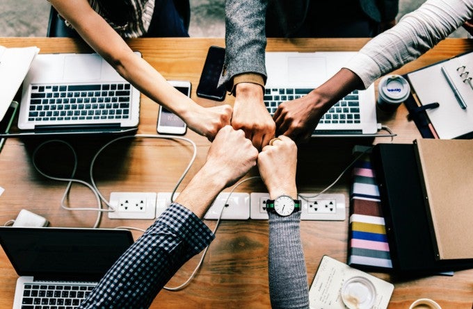 Hands together to show millennial work and millennial values