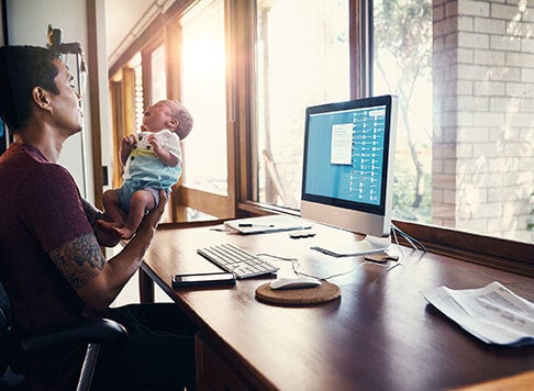 Father and baby at work