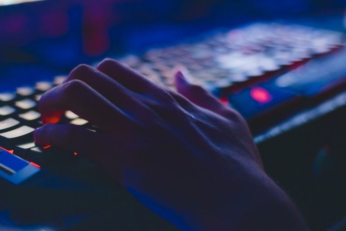 Hands on keyboard doing cyber security