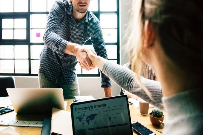 Employer shaking hand online degree