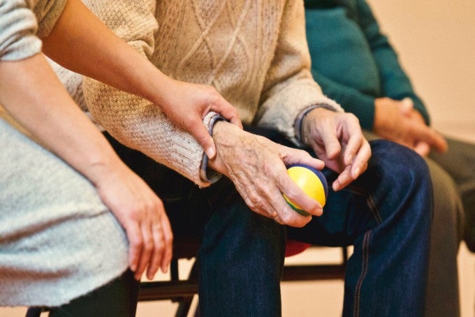 nurse helping older person