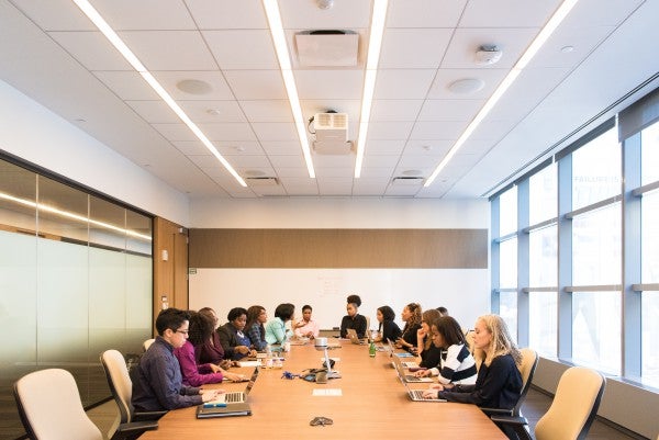 Boardroom meeting of diverse individuals with cultural intelligence