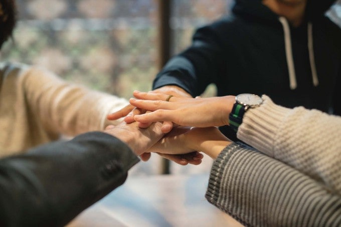 Diverse hands together showing cultural intelligence