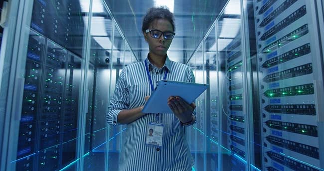 IT professional doing server diagnostics check.