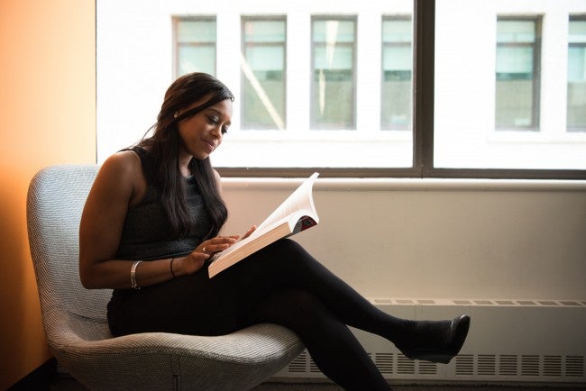 woman reading alone | continuing education