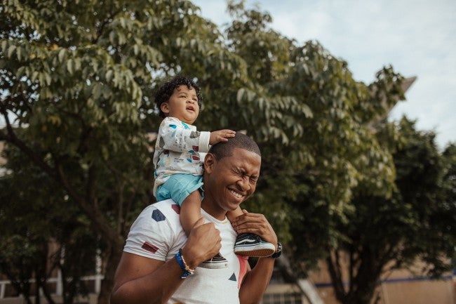 Dad with son on shoulders