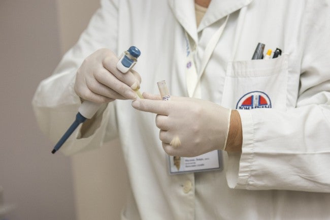 Doctor hands preparing shot