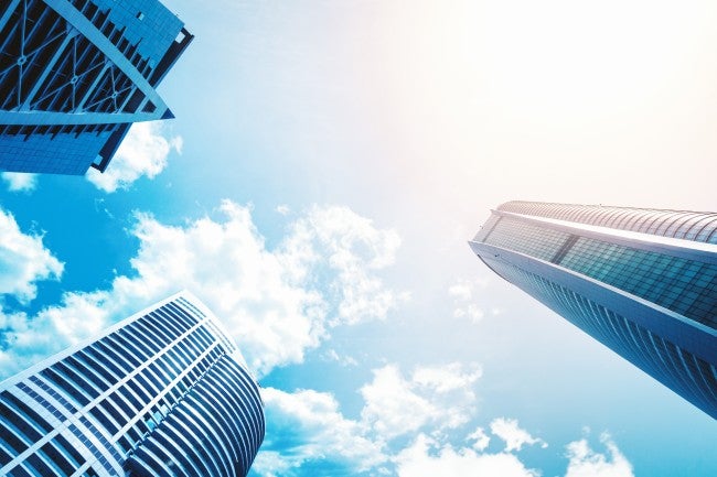 Looking up at clouds and buildings