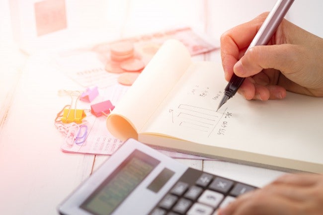 Calculator and paper, accounting work