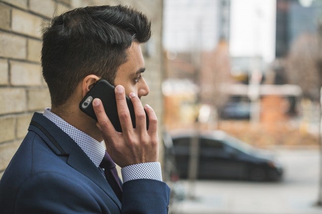 Man on phone with WGU enrollment counselor