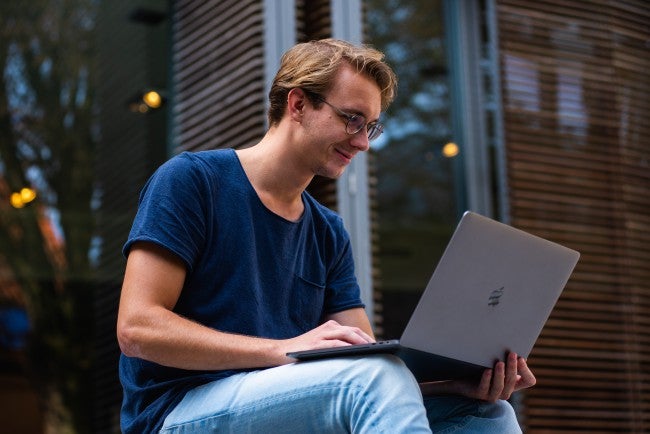 college student with laptop