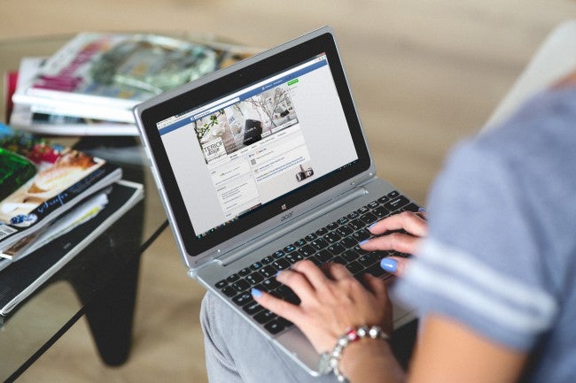 Woman typing on laptop | Social media