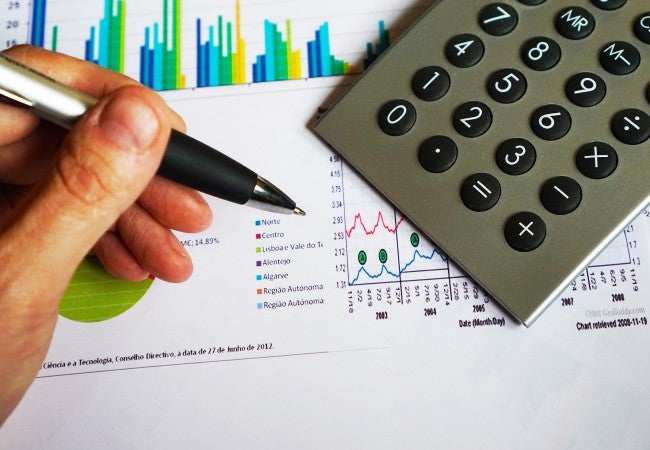 write 10 career opportunities in business studies Man holding pen over paper and calculator