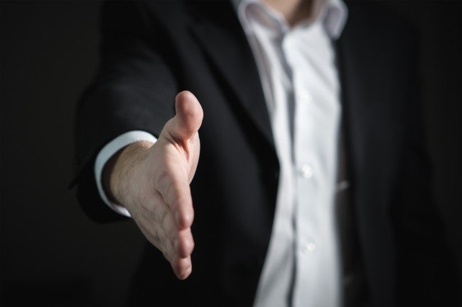 Hand extended for handshake during job interview