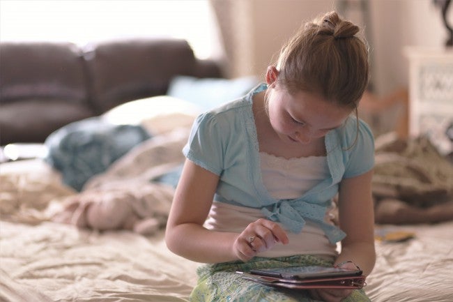 problem solving with technology Child playing on tablet