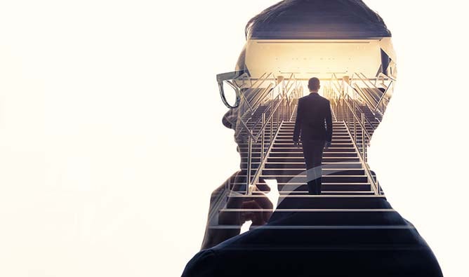 Overlay of a businessman reflecting while a self-image climbs stairs.