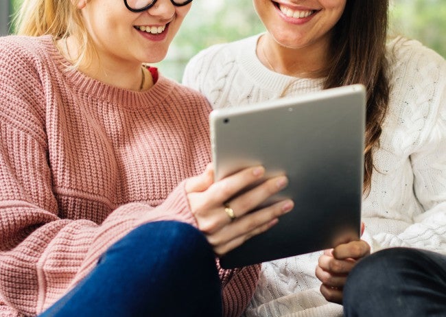 Women looking at tablet OS