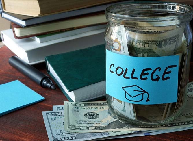 A mason jar filled with cash labeled "college."