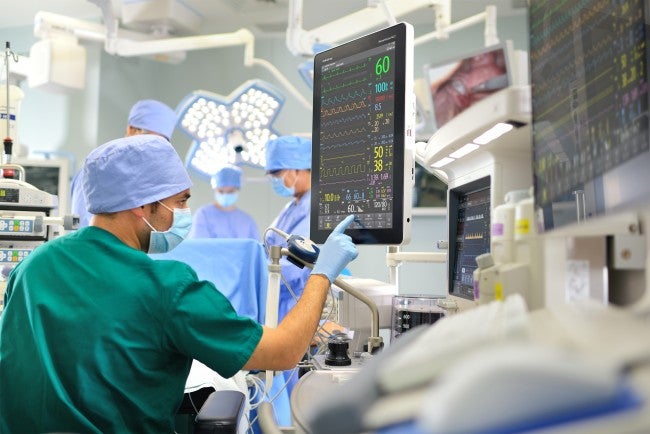 Trauma nurse monitoring vitals