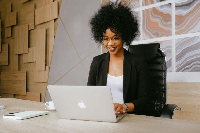 Woman typing on laptop