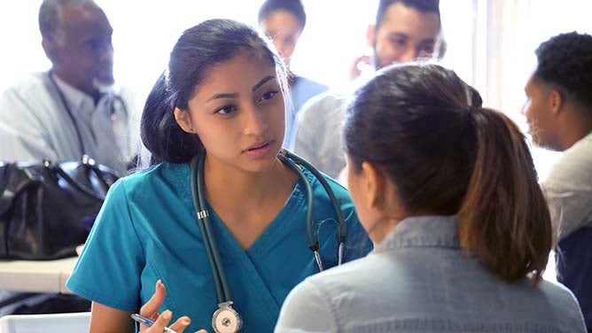 A young nurse works among the community to dispel medical ignorance.