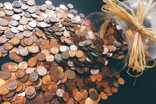 Pennies spilling out of jar - online college free