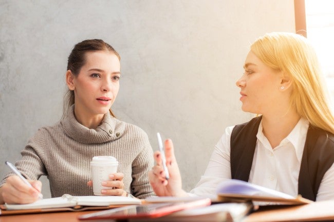 Two women talking at work - best career outlook