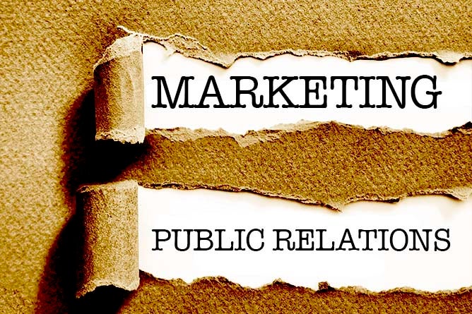 Torn paper reveals the words "marketing" and "public relations."